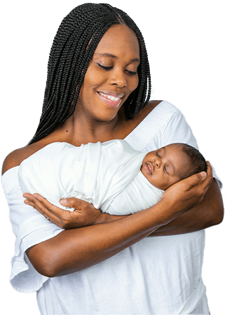African-American woman cradling newborn baby